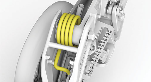 A simple spring arrangement provides adjustable packing pressure.