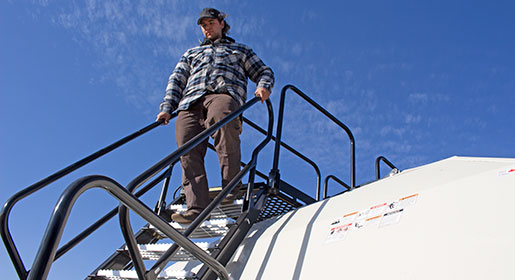 Staircase access from either side of the tank includes secure hand rails and wide grated cast steps.