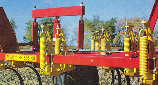 All 330 series cultivators used a 330 lb. initial tension spring cushion shank assembly.