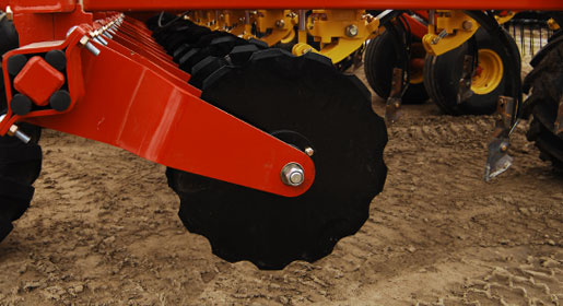 The coulters are mounted with rubber torsion elements that are capable of transferring the force necessary to cut heavy straw, pea vines, unharvested swathes